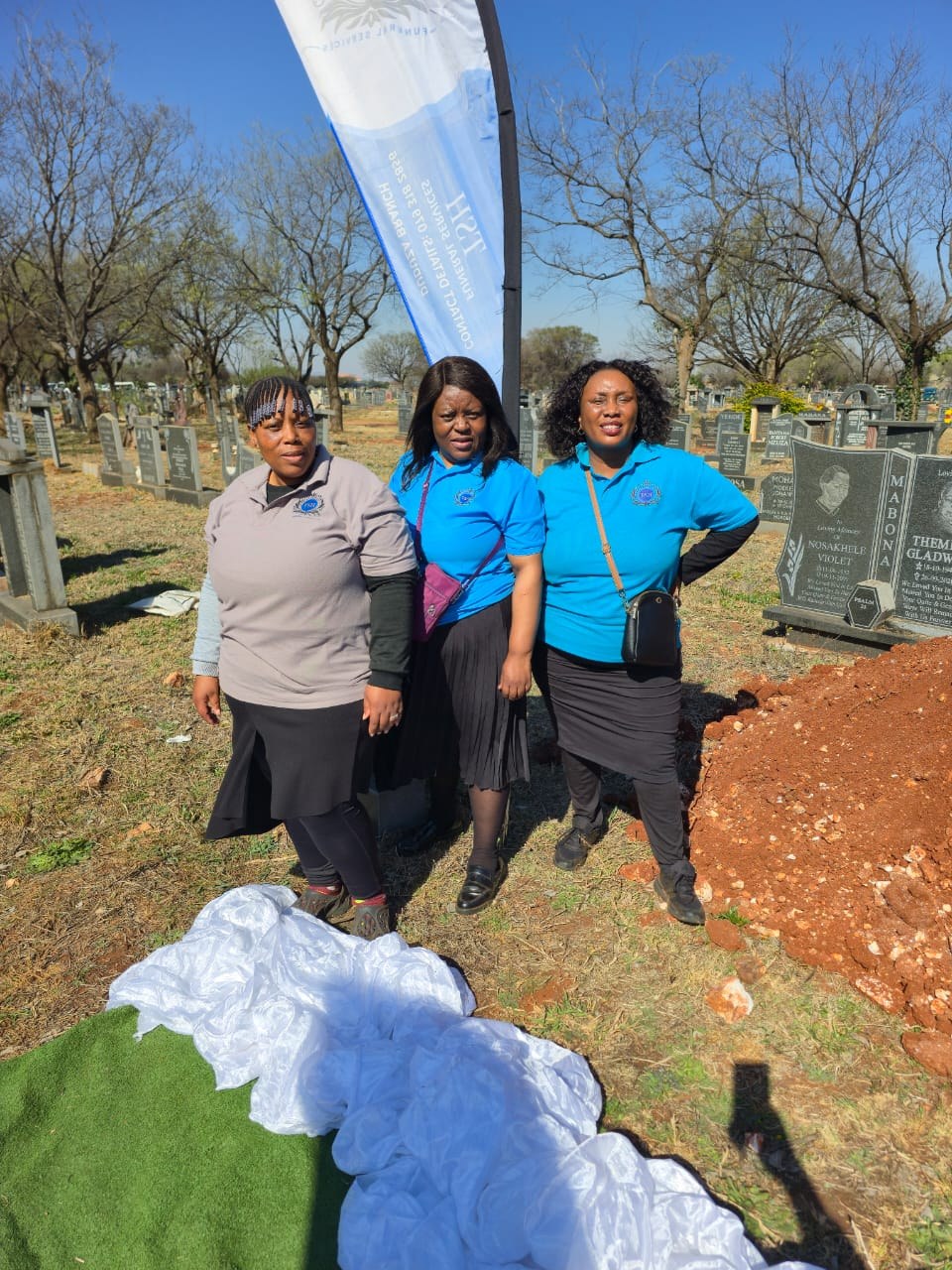 TSH team members at an outdoor funeral gathering